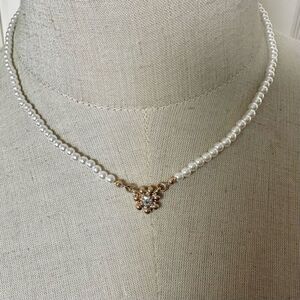 Faux pearl gold tone flower pendant necklace